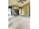 Cozy living room with fireplace and ceiling fan to relax and enjoy the ambiance at 13080 Philadelphia Church Rd, Oakboro, NC 28129