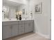 Bathroom featuring double sinks, modern cabinetry, and neutral tile at 145 Shepherds Landing Dr, Mooresville, NC 28115