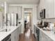 Stylish kitchen featuring stainless steel appliances, gray cabinetry, and ample counter space at 145 Shepherds Landing Dr, Mooresville, NC 28115