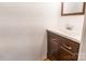 Bathroom vanity with wood cabinet, white sink, chrome faucet, and framed mirror at 1461 Flintwood Dr, Rock Hill, SC 29732
