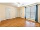 Spacious bedroom with hardwood floors, two closets, and a bright window with curtains at 1461 Flintwood Dr, Rock Hill, SC 29732