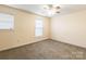 Bedroom with neutral walls, carpet, ceiling fan and two windows for ample natural light at 1461 Flintwood Dr, Rock Hill, SC 29732