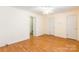 A light filled room with hardwood floors, ceiling fan, and multiple doors at 1461 Flintwood Dr, Rock Hill, SC 29732