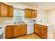 Bright kitchen with stainless steel sink, wooden cabinets, and modern appliances at 1461 Flintwood Dr, Rock Hill, SC 29732