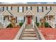 Inviting townhouse with red front door and covered porch at 1465 Flintwood Dr, Rock Hill, SC 29732