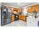 Functional kitchen with stainless steel refrigerator and wood cabinets at 1465 Flintwood Dr, Rock Hill, SC 29732
