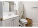 Bathroom featuring a clean white vanity, toilet, and a shower with curtain at 1469 Flintwood Dr, Rock Hill, SC 29732