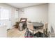 Inviting dining area featuring a round table with four chairs, a wicker storage bench, and natural light at 1469 Flintwood Dr, Rock Hill, SC 29732