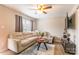 Bright living area with a large sectional couch, ceiling fan, and modern decor at 1469 Flintwood Dr, Rock Hill, SC 29732