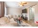 Cozy living room with a comfortable sectional sofa, ceiling fan, and mounted television at 1469 Flintwood Dr, Rock Hill, SC 29732