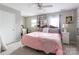 Comfortable bedroom with a canopy bed, ceiling fan, and neutral decor at 1469 Flintwood Dr, Rock Hill, SC 29732