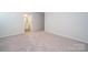Spacious bedroom with neutral carpet and an ensuite bathroom at 1758 Braemar Village Dr, Monroe, NC 28110