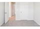 Neutrally decorated bedroom showing entry to another room at 1758 Braemar Village Dr, Monroe, NC 28110