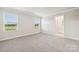 Bright bedroom with two windows and plush carpet, offering a cozy and comfortable space at 1762 Braemar Village Dr, Monroe, NC 28110