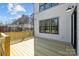 A new wood back deck with house siding in the background at 1828 Haines St, Charlotte, NC 28216