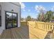 Back deck with sliding glass doors and a view of the yard at 1828 Haines St, Charlotte, NC 28216