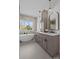 Modern bathroom featuring a soaking tub, large window, double sinks, and sleek vanity at 1828 Haines St, Charlotte, NC 28216