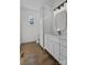 Bright bathroom with white cabinets, quartz countertops, and modern fixtures at 1828 Haines St, Charlotte, NC 28216