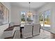 Bright dining room boasts a built-in bench, and access to a deck at 1828 Haines St, Charlotte, NC 28216