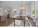 Open concept dining area featuring built-in bench, kitchen, and backyard access at 1828 Haines St, Charlotte, NC 28216