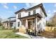 Beautiful home exterior with covered front porch, manicured lawn, and modern architectural details at 1828 Haines St, Charlotte, NC 28216