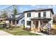 Attractive home exterior featuring a covered porch, well-maintained landscaping, and modern design at 1828 Haines St, Charlotte, NC 28216
