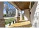 Relaxing front porch showcasing a wooden ceiling, brick column bases, and pleasant outdoor space at 1828 Haines St, Charlotte, NC 28216