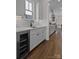Modern kitchen area with sleek cabinets, stylish backsplash, and stainless steel appliances at 1828 Haines St, Charlotte, NC 28216