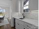 Chic kitchen area featuring white cabinets, stone counters, and a stainless beverage cooler at 1828 Haines St, Charlotte, NC 28216