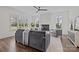 Bright living room features a fireplace, ceiling fan, and large windows at 1828 Haines St, Charlotte, NC 28216