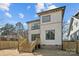 Back of the home with a wood deck, dark window frames, and a fenced yard at 1828 Haines St, Charlotte, NC 28216