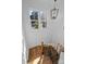 The Staircase features decorative molding, wooden stairs, and modern light fixture at 1828 Haines St, Charlotte, NC 28216