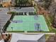 Aerial view of a basketball court with three hoops and a parking lot nearby at 1874 Larkspur Way, Tega Cay, SC 29708