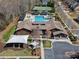Expansive community clubhouse featuring a pool, slides, tennis courts, playground and ample parking at 1874 Larkspur Way, Tega Cay, SC 29708