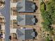 Birds eye view of neighborhood homes showcasing roof lines, driveways and mature landscaping at 1874 Larkspur Way, Tega Cay, SC 29708
