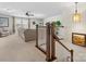 Bright living room featuring neutral decor, a ceiling fan, and staircase to upper level at 1874 Larkspur Way, Tega Cay, SC 29708