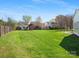 Large backyard featuring a shed, patio, and lush lawn, offering ample space for relaxation and recreation at 2020 Holly Villa Cir, Indian Trail, NC 28079