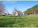 Expansive backyard with lush lawn and mature trees, perfect for outdoor activities and entertaining at 2020 Holly Villa Cir, Indian Trail, NC 28079
