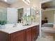 Bright bathroom featuring a dual vanity, mirrors, and modern fixtures at 2020 Holly Villa Cir, Indian Trail, NC 28079