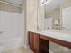 Bathroom featuring a large vanity with built-in cabinets, a wide mirror, and a shower/tub combination at 2020 Holly Villa Cir, Indian Trail, NC 28079