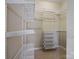 Organized walk-in closet with adjustable shelving and storage solutions at 2020 Holly Villa Cir, Indian Trail, NC 28079