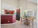 A dining area features a wooden table and a black refrigerator at 2020 Holly Villa Cir, Indian Trail, NC 28079