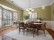 Elegant dining room with a chandelier, large windows, and stylish decor at 2020 Holly Villa Cir, Indian Trail, NC 28079