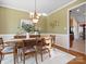 Beautiful dining room featuring a classic chandelier, dining table, and elegant decor at 2020 Holly Villa Cir, Indian Trail, NC 28079