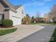 Spacious driveway leading to a two-car garage, offering ample parking at 2020 Holly Villa Cir, Indian Trail, NC 28079