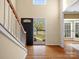 Bright and airy entryway with hardwood floors, a staircase, and a view of the outdoors at 2020 Holly Villa Cir, Indian Trail, NC 28079