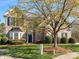 Charming two-story brick home with a well-manicured lawn and beautiful landscaping at 2020 Holly Villa Cir, Indian Trail, NC 28079