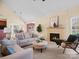 Inviting living room with a fireplace, comfortable seating, and open layout to dining area at 2020 Holly Villa Cir, Indian Trail, NC 28079