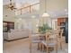 A living room and dining area beneath a cathedral ceiling with 2nd-story overlook at 2020 Holly Villa Cir, Indian Trail, NC 28079