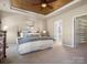 Cozy main bedroom features tray ceiling and ensuite bathroom and walk in closet at 2020 Holly Villa Cir, Indian Trail, NC 28079